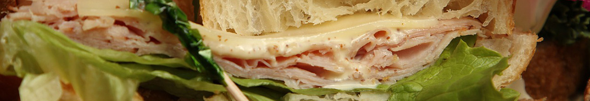 Eating Deli Sandwich at DeSimone Deli & Bakery restaurant in Huntington Beach, CA.